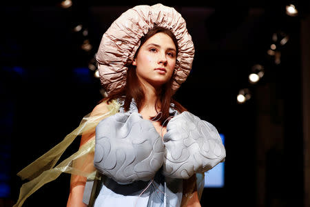 A model presents a creation by students of fashion colleges during the Berlin Fashion Week Autumn/Winter 2019/20 in Berlin, Germany, January 14, 2019. REUTERS/Fabrizio Bensch