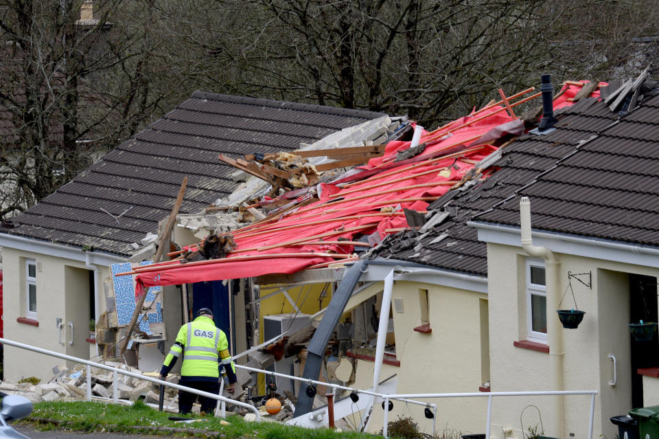 <em>Locals said the woman in her 70s walked out of the wreckage with the help of a young neighbour who heard the blast in Buckfastleigh, Devon (Picture: SWNS)</em>