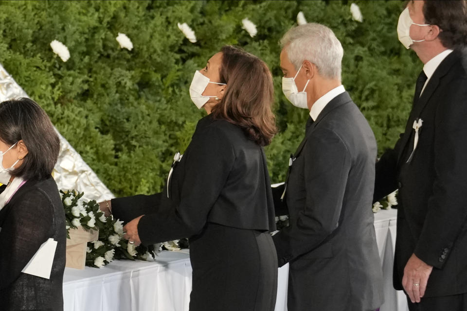 U.S. Vice President Kamala Harris, center, followed by U.S. Ambassador to Japan Rahm Emanuel attend the state funeral of assassinated former Prime Minister Shinzo Abe Tuesday, Sept. 27, 2022, at Nippon Budokan in Tokyo. (AP Photo/Eugene Hoshiko, Pool)