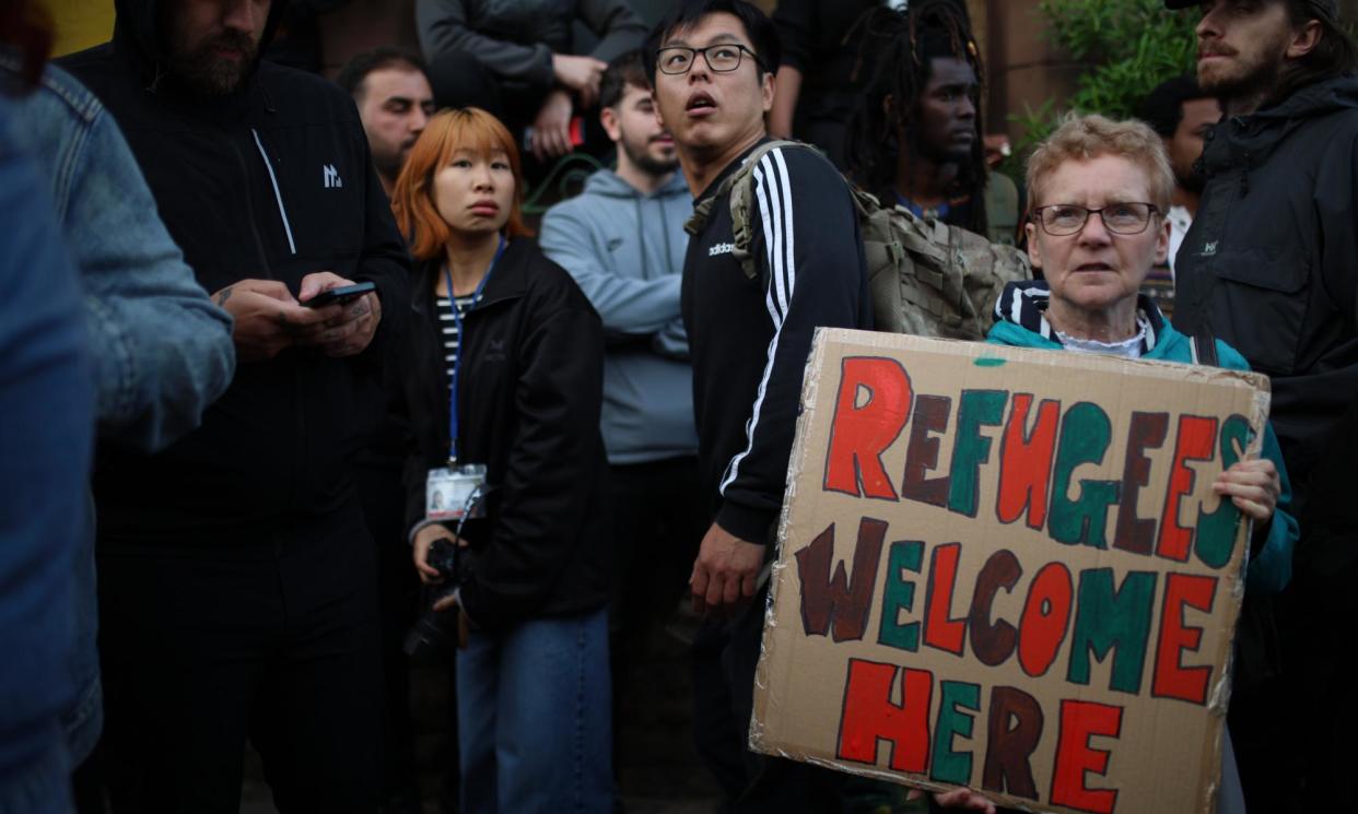 <span>More than 2,000 anti-racism protesters congregated around Liverpool’s St Anne’s church, which hosts an immigration centre that featured on a far-right ‘hitlist’.</span><span>Photograph: Ryan Jenkinson/Getty Images</span>