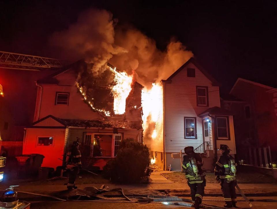 Firefighters battled a three-alarm blaze on Franklin Street in Hackensack that damaged two buildings and sent six people to the hospital with minor injuries on Tuesday, Jan. 18, 2022.