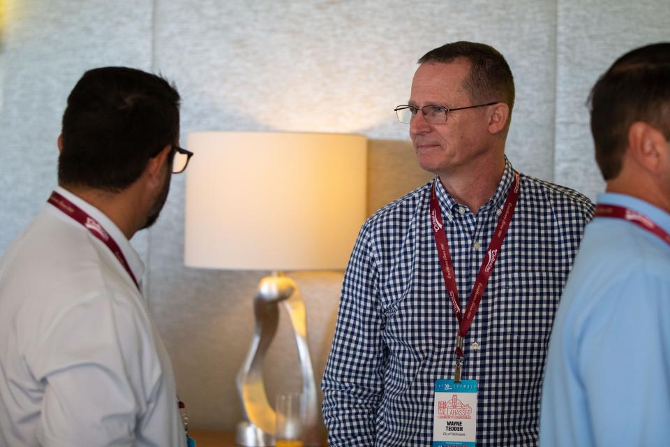 Assistant City Manager Wayne Tedder talks with other Chamber of Commerce Conference attendees on Saturday, Aug. 19, 2023.