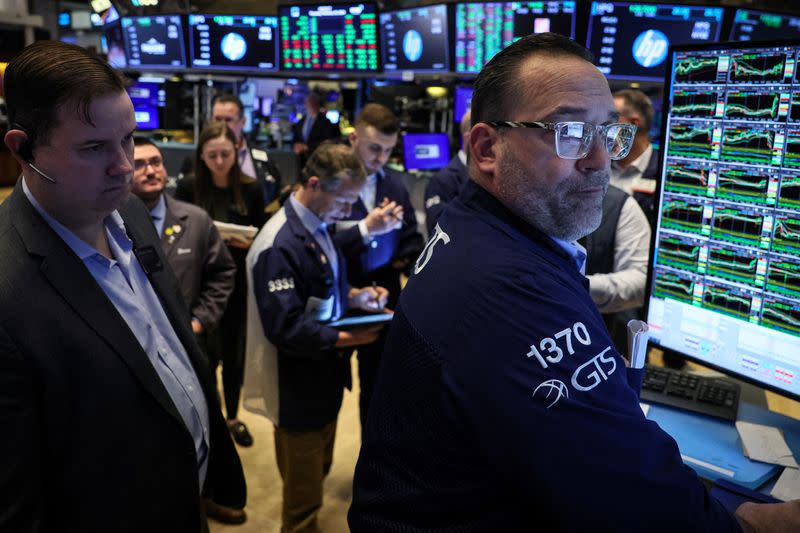 Traders work on the floor of the NYSE in New York