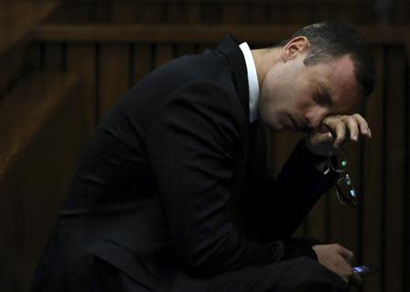 Oscar Pistorius attends his trial at the high court in Pretoria April 7, 2014. REUTERS/Themba Hadebe/Pool