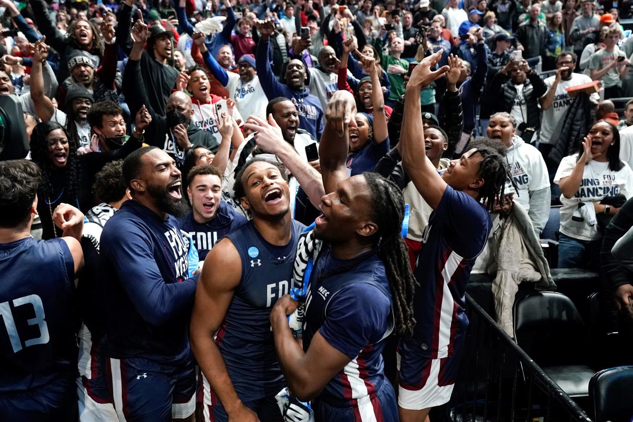 Fairleigh Dickinson players celebrate beating Purdue during the first round of the NCAA men's tournament at Nationwide Arena, Friday, March 17, 2023, in Columbus, Ohio.