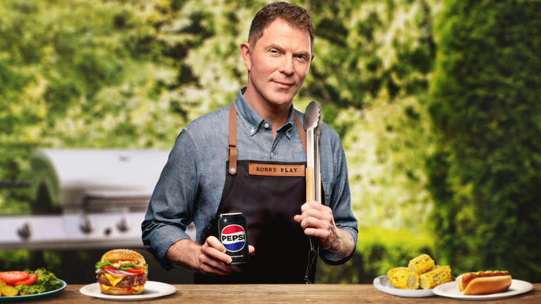 Bobby Flay holding Pepsi can