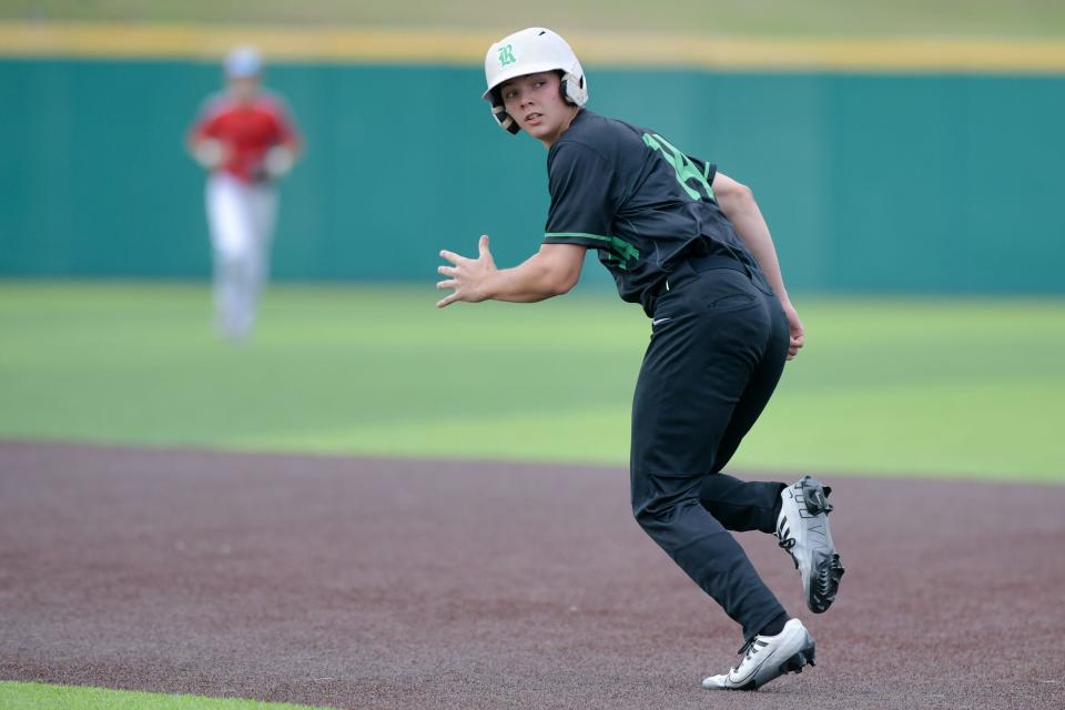 Riverside's Drake Fox escapes a pickoff attempt during a rundown between first and second base during Thursday's PIAA class 3A playoff game against Fairview at Slippery Rock University.