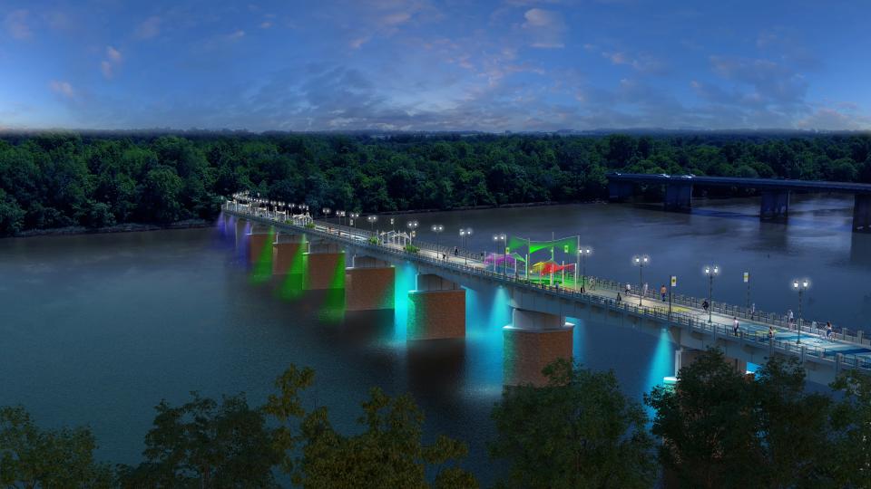 This artist's rendering shows how the Fifth Street Bridge might be lighted at night as a linear pedestrian park. The view, from above the Riverwalk Marina, faces South Carolina.