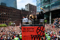 NBA Finals MVP Kawhi Leonard raises the trophy on top of the bus during the Toronto Raptors Championship parade on June 13, 2019 in Toronto, ON, Canada. (Photo by Julian Avram/Icon Sportswire via Getty Images)