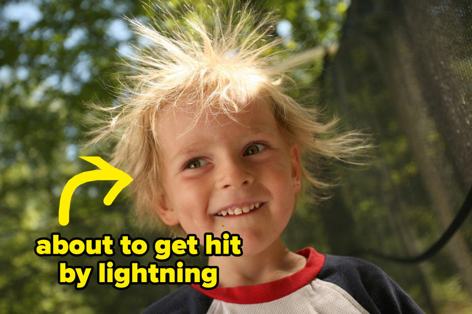 kid with hair standing straight up