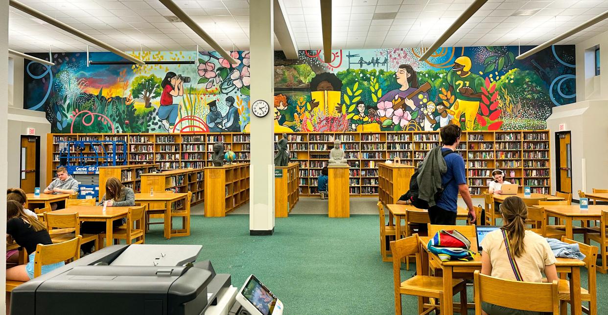 Adrienne Luther's mural lives on the wall of Rock Bridge High School's media center.