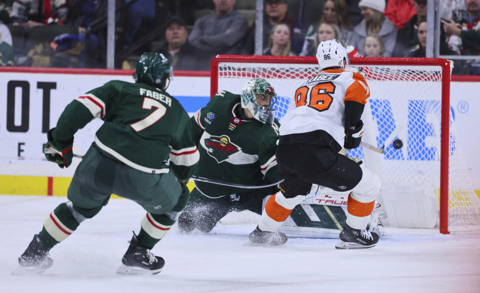 Philadelphia Flyers left wing Joel Farabee (86) scores a goal against Minnesota Wild goaltender Marc-Andre Fleury during the second period of an NHL hockey game Friday, Jan. 12, 2024, in St. Paul, Minn. (AP Photo/Adam Bettcher)