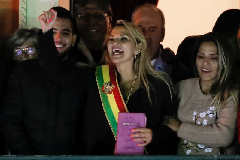 Bolivian Senator Jeanine Anez gestures after she declared herself as Interim President of Bolivia, at the balcony of the Presidential Palace, in La Paz