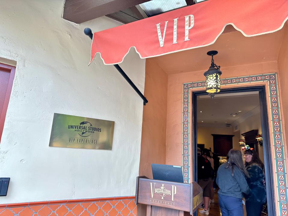 VIP lounge entrance with red awning above doorway