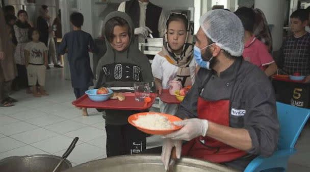 PHOTO: Zarlasht is served food at Salam Cafe (ABC News)