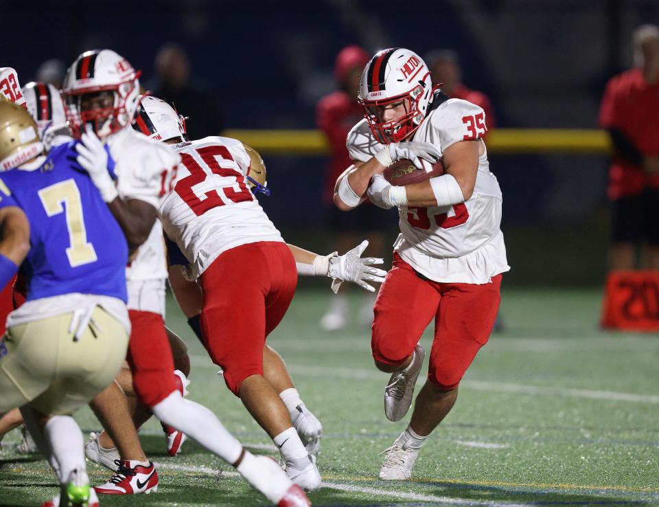 Hilton running back John DiBattisto looks for yards against Schroeder.