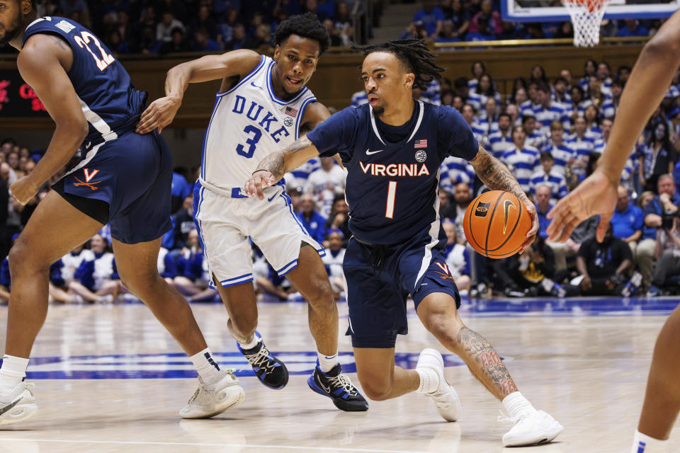 Virginia's Dante Harris (1) handles the ball as Duke's Jeremy Roach (3) defends during the first half of an NCAA college basketball game in Durham, N.C., Saturday, Mar. 2, 2024. (AP Photo/Ben McKeown)