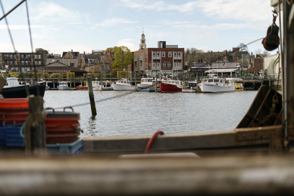 Fishing boats are docked in the harbor of Gloucester, Mass., May 11, 2022. A bevy of companies is installing high-resolution cameras on U.S. fishing boats to replace scarce in-person observers and meet new federal mandates aimed at protecting dwindling fish stocks. (AP Photo/David Goldman)