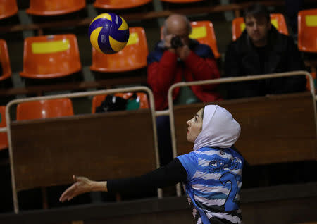 Iranian volleyball player Zeinab Giveh serves the ball during a training session of "Shumen" volleyball club in Shumen, Bulgaria January 14, 2017. Picture taken on January 14, 2017. REUTERS/Stoyan Nenov