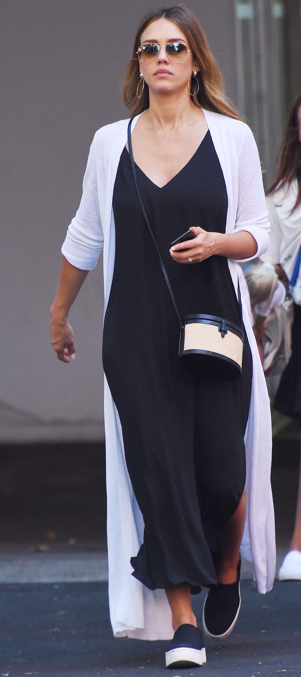 <p>Alba looked HONESTly amazing when she stepped out in N.Y.C. wearing a plunging black maxidress, Vince platform sneakers ($225; <a rel="nofollow noopener" href="http://www.saksfifthavenue.com/main/ProductDetail.jsp?PRODUCT%3C%3Eprd_id=845524446994901" target="_blank" data-ylk="slk:saksfifthavenue.com;elm:context_link;itc:0;sec:content-canvas" class="link ">saksfifthavenue.com</a>), and a white duster. </p>