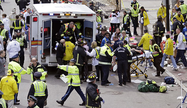 Medical workers help the injured at Boston Marathon (Charles Krupa/AP)
