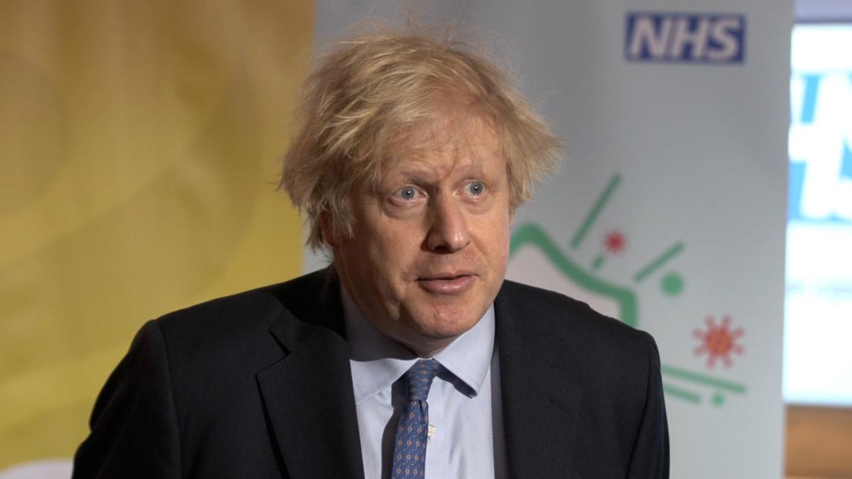 Boris Johnson defended the 1% pay rise for NHS workers as he visited a vaccination centre in London on Sunday. (.)