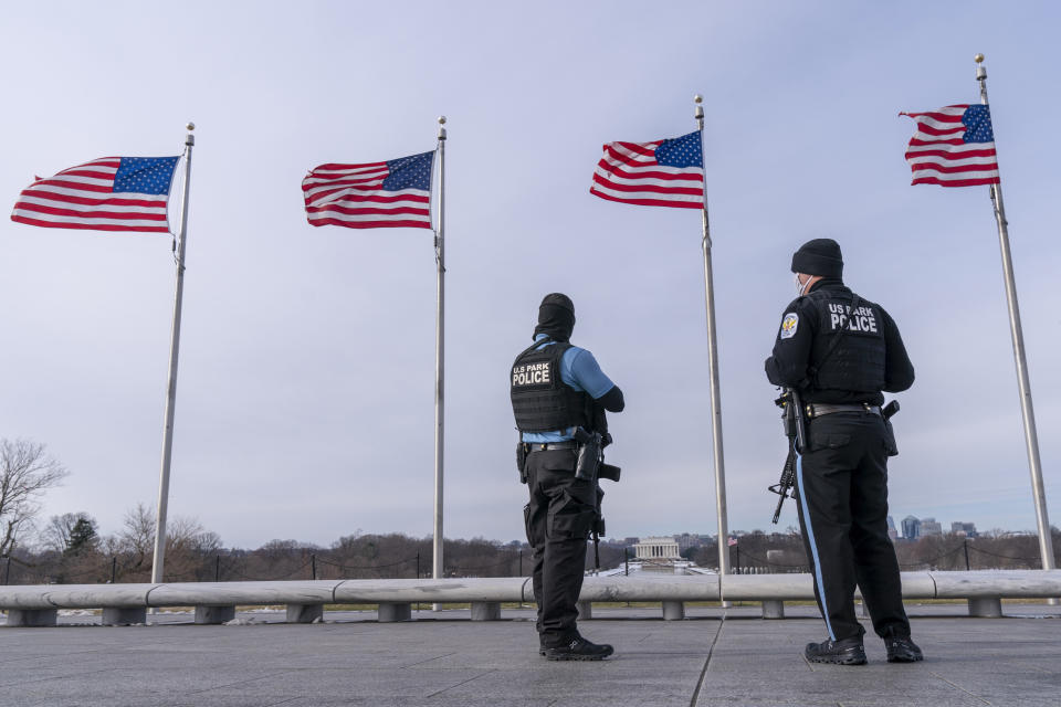 A year after the attack on the U.S. Capitol, U.S. Park Police patrol at the Washington Monument, with the Lincoln Memorial in the background, Thursday, Jan. 6, 2022, along the National Mall in Washington. Thursday marks the first anniversary of the Capitol insurrection, a violent attack that has fundamentally changed Congress and prompted widespread concerns about the future of American democracy. (AP Photo/Jacquelyn Martin)