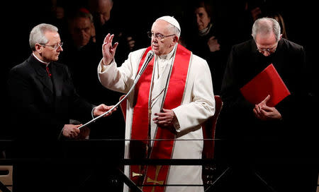 Pope Francis leads the Via Crucis (Way of the Cross) procession during Good Friday celebrations at the Colosseum in Rome, Italy March 30, 2018. REUTERS/Remo Casilli