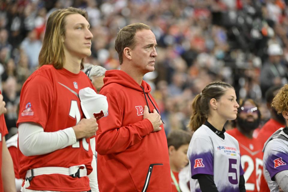 AFC quarterback Trevor Lawrence (16) of the Jacksonville Jaguars stands alongside coach Peyton Manning during the flag football event at the NFL Pro Bowl, Sunday, Feb. 5, 2023, in Las Vegas. (AP Photo/David Becker)