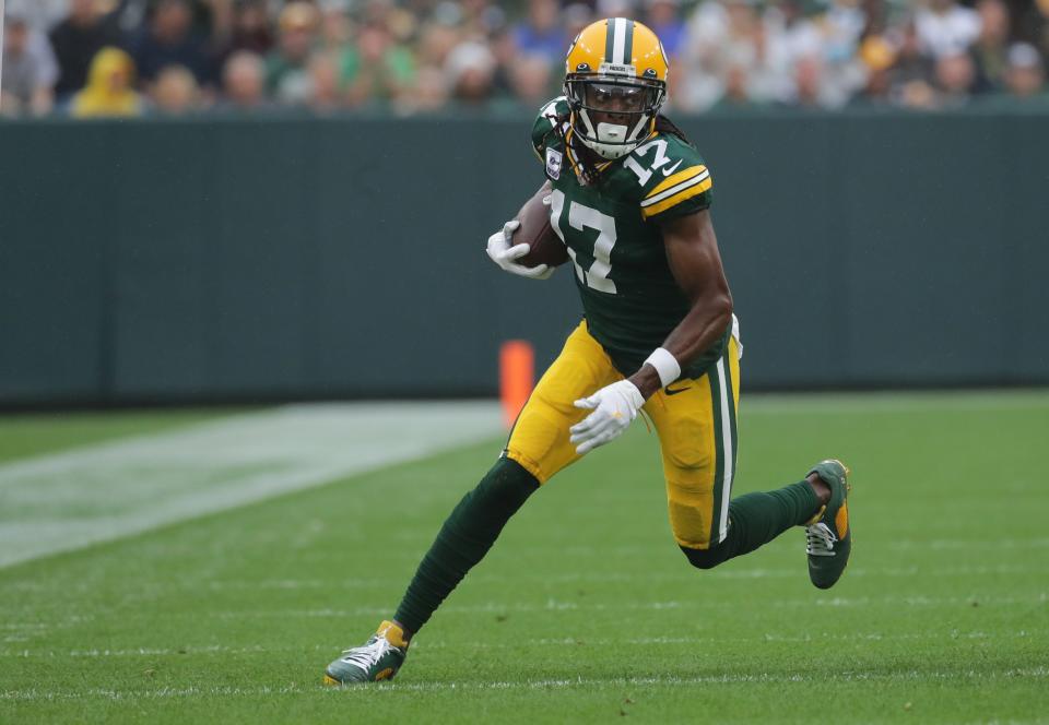 Green Bay Packers wide receiver Davante Adams (17) picks up a first down on a reception during the first quarter of their game Sunday, October 3, 2021 at Lambeau Field in Green Bay, Wis. Green Bay Packers beat the Pittsburgh Steelers 27-17.MARK HOFFMAN/MILWAUKEE JOURNAL SENTINEL