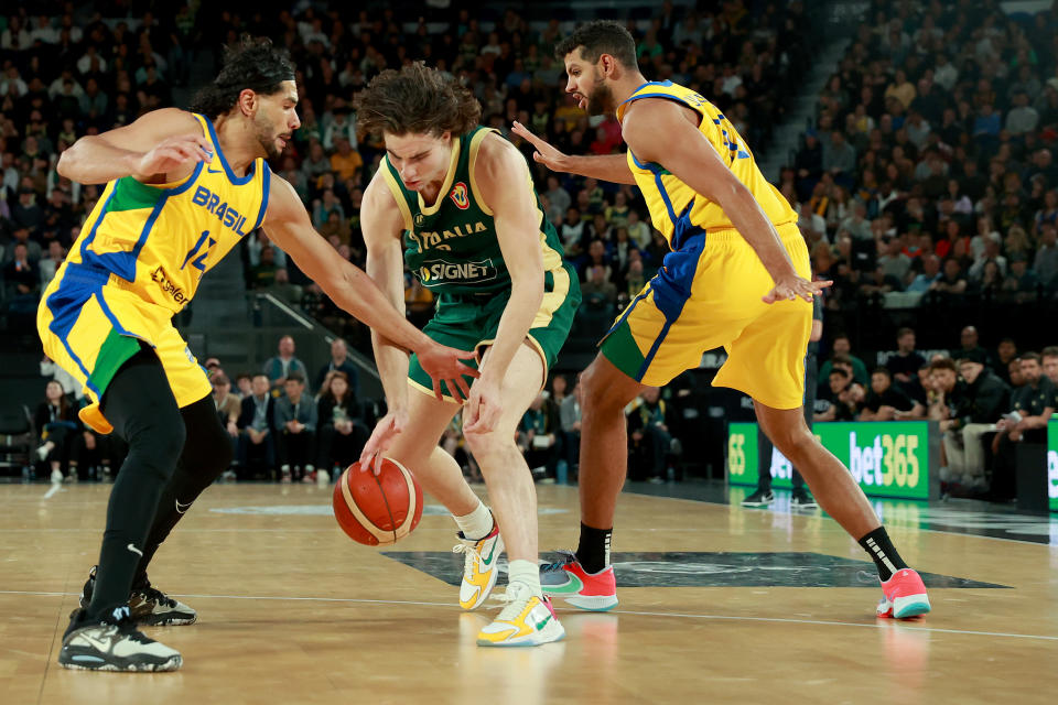 MELBOURNE, AUSTRALIA – AUGUST 16: Leonardo Meindl of Brazil and Josh Giddey of Australia compete for possession during the match between the Australia Boomers and Brazil at Rod Laver Arena on August 16, 2023 in Melbourne, Australia. (Photo by Kelly Defina/Getty Images)
