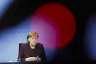 German Chancellor Angela Merkel briefs the media during a news conference after a meeting at the chancellery in Berlin, Germany, Wednesday, Feb. 10, 2021. German chancellor Angela Merkel had meet with German head of federal states to discuss extension of restrictions or other possible measures to battle the coronavirus pandemic in the country (AP Photo/Markus Schreiber)