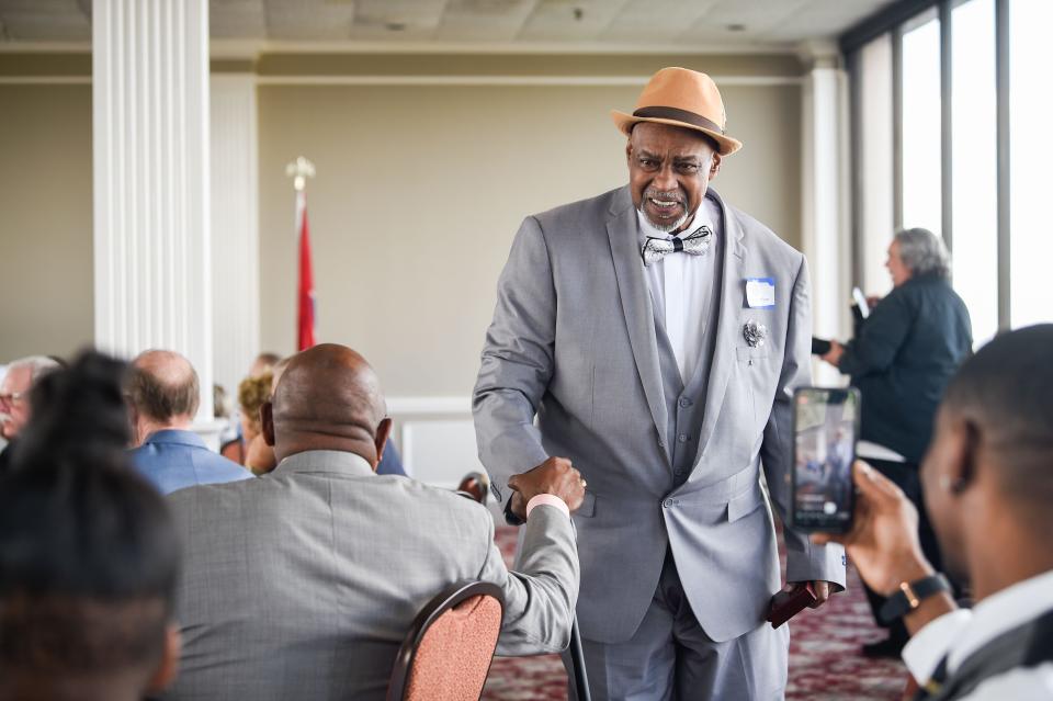 Shawney Bo Wynn shakes hands with other recipients after he accepted his MNPS's Sports Hall of Fame during the induction ceremony at Millennium Maxwell House in Nashville, Tenn., Thursday, April 7, 2022. 