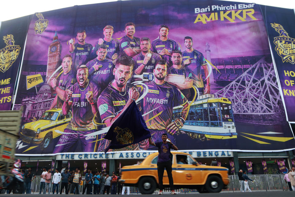 IPL: A fan of Kolkata Knight Riders ( KKR) wave the KKR Flag  in front of Eden Gardens Cricket Stadium during the IPL T-20 in Kolkata,India on April 05,2023.  (Photo by Debajyoti Chakraborty/NurPhoto via Getty Images)