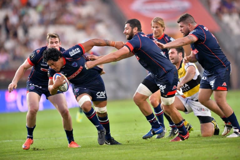 Grenoble's New Zealand flanker Steven Setephano (2-L) runs with the ball during the Top 14 rugby union match between Grenoble (FCG) and Stade Rochelais (SR) at the Stade des Alpes in Grenoble, central-eastern France, on August 27, 2016