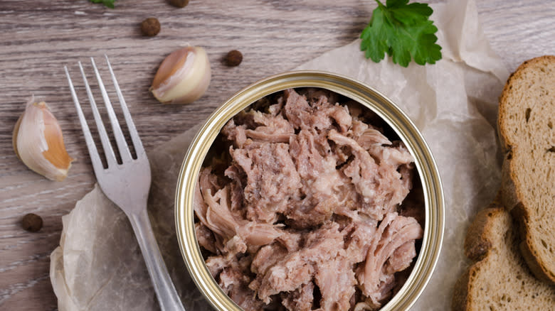 Open tin of canned chicken