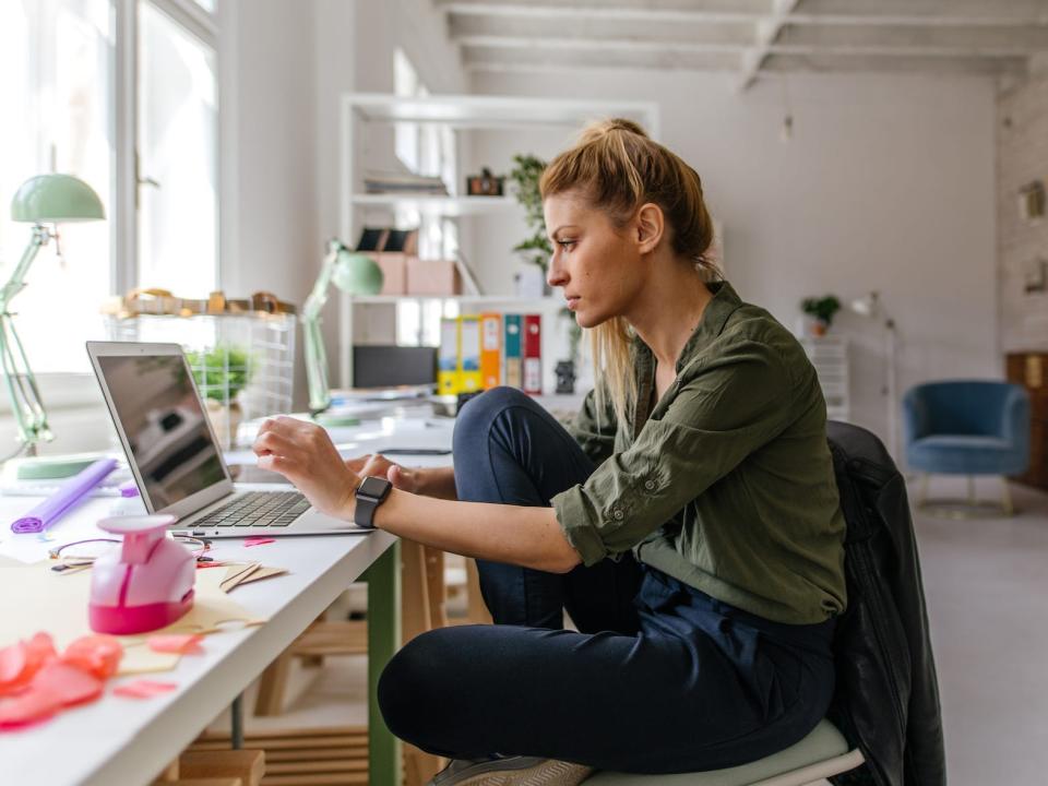 woman working from home office on laptop