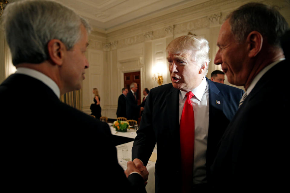 President Donald Trump shakes hands with JPMorgan Chase CEO Jamie Dimon as he hosts a strategy and policy forum with chief executives of major U.S. companies at the White House in Washington February 3, 2017. (REUTERS/Kevin Lamarque)