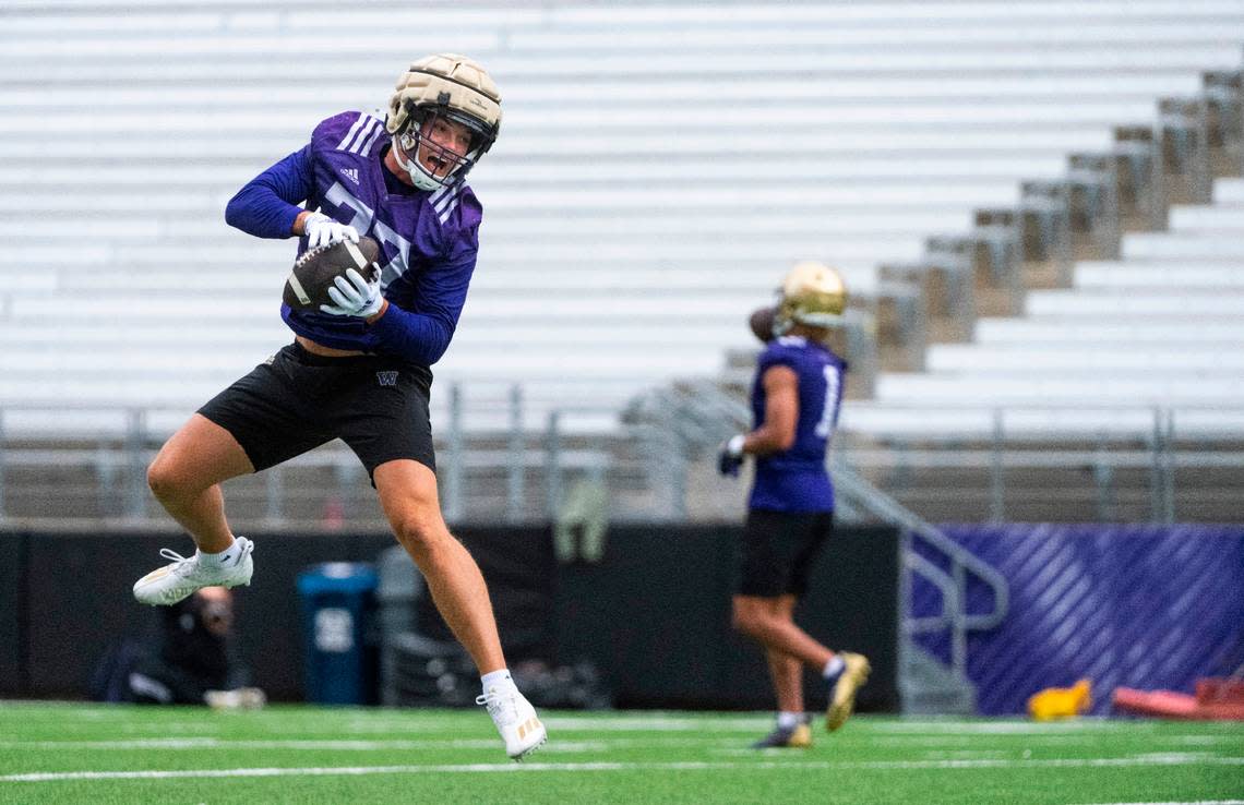 University of Washington Huskies tight end Jack Westover, 37, jumps to catch the ball during a drill at the first day of Fall practice at Husky Stadium on Thursday, Aug. 4, 2022 in Seattle, Wash.