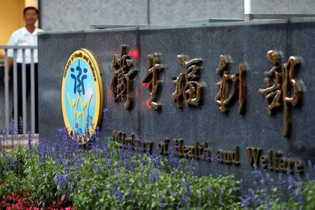 A security stands guard during Taiwan's Ministry of Health and Welfare's news conference on how Taiwan would react if it is not invited to the World Health Assembly (WHA), in Taipei, Taiwan May 8, 2017. REUTERS/Tyrone Siu