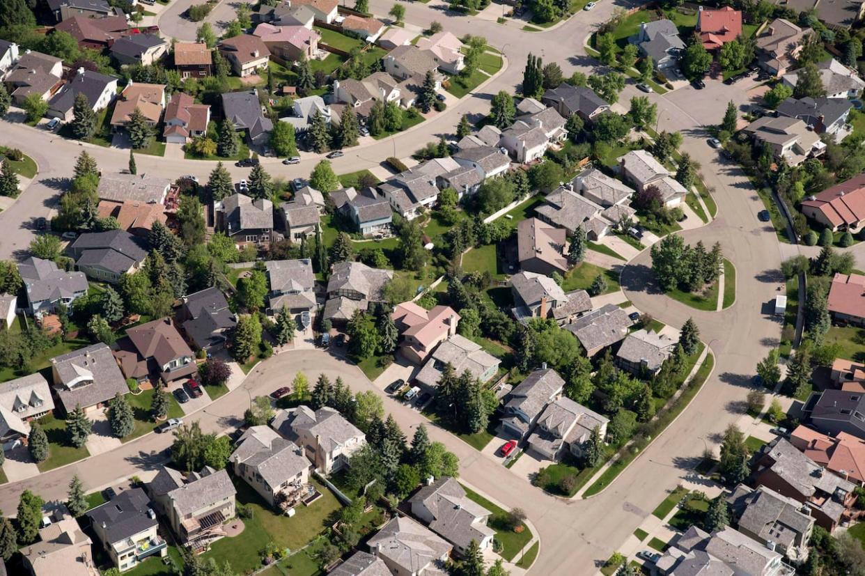 Some Calgary real estate professionals say Canada's move to extend the mortgage amortization limit from 25 to 30 years for first-time buyers purchasing new homes won't make much difference.  (Jonathan Hayward/The Canadian Press - image credit)