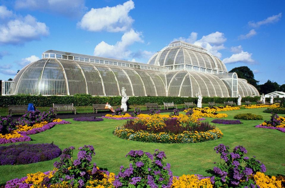 england,london,kew gardens,palm house and flowerbeds