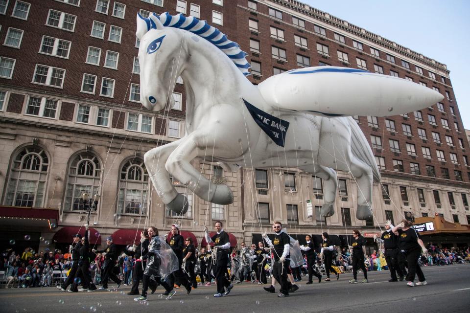 The "Peggy Bank" inflatable horse balloon floats down Broadway during the Kentucky Derby Festival Pegasus Parade in Louisville, Ky. April 30, 2015.