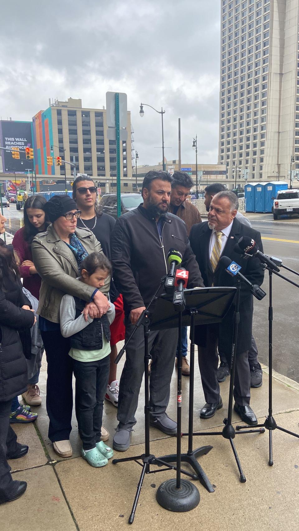 Yahya Alarayshi speaks at a news conference talking about a lawsuit attorneys filed Oct. 13, 2023, against the State and Defense departments to help evacuate his parents and other Palestinian Americans from Gaza who are trying to leave. Next to him is his wife, Lisa, and other family members.