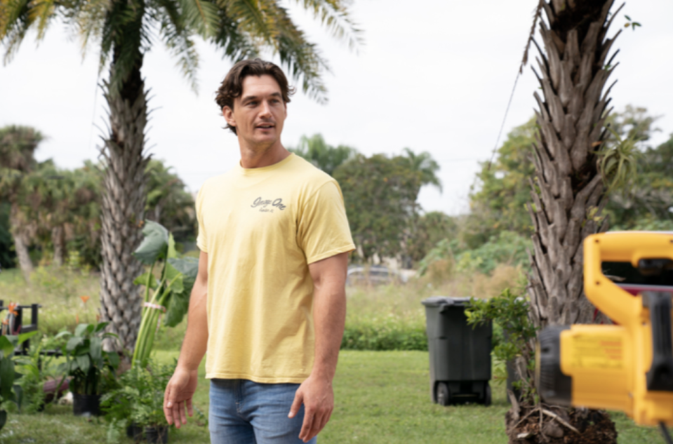 a man standing in a yard