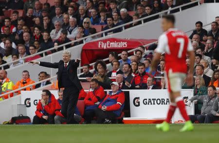 Britain Football Soccer - Arsenal v Manchester City - Premier League - Emirates Stadium - 2/4/17 Arsenal manager Arsene Wenger gestures as Arsenal's Alexis Sanchez is in action Reuters / Eddie Keogh Livepic