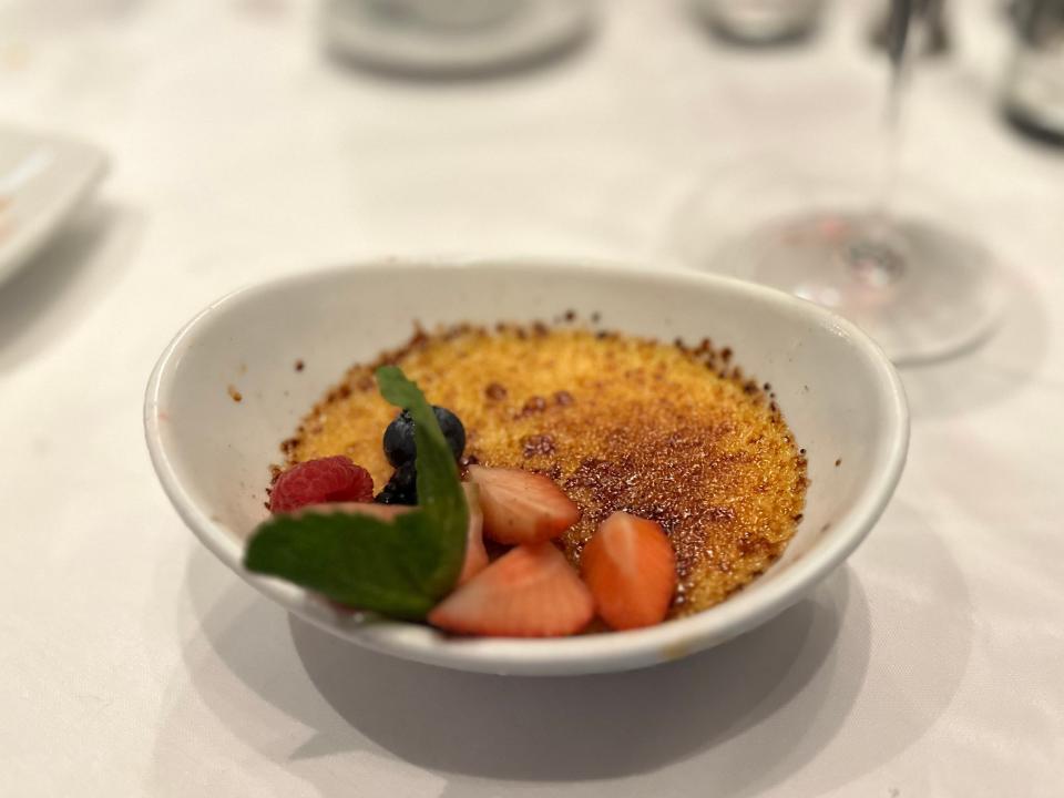 caramelizded sugar in a bowl with strawberries on top