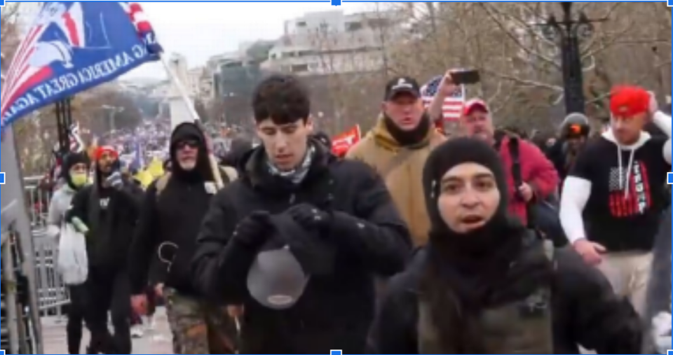 James Grant, 29, of Cary walks toward the U.S. Capitol after breaking through a police line on Jan. 6, 2021. A judge ordered Grant returned to federal custody following his Wake County DUI arrest on Dec. 7. Grant faces seven charges in connection with the Capitol violence.