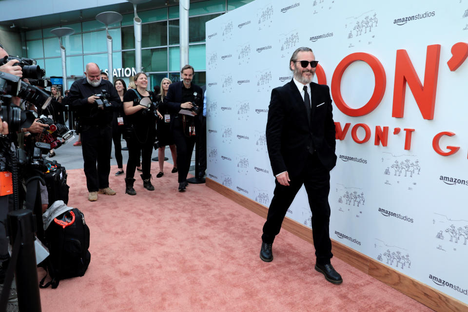 Joaquin Phoenix poses at the premiere for the movie "Don't Worry, He Won't Get Far On Foot" in Los Angeles, California, U.S., July 11, 2018. REUTERS/Monica Almeida