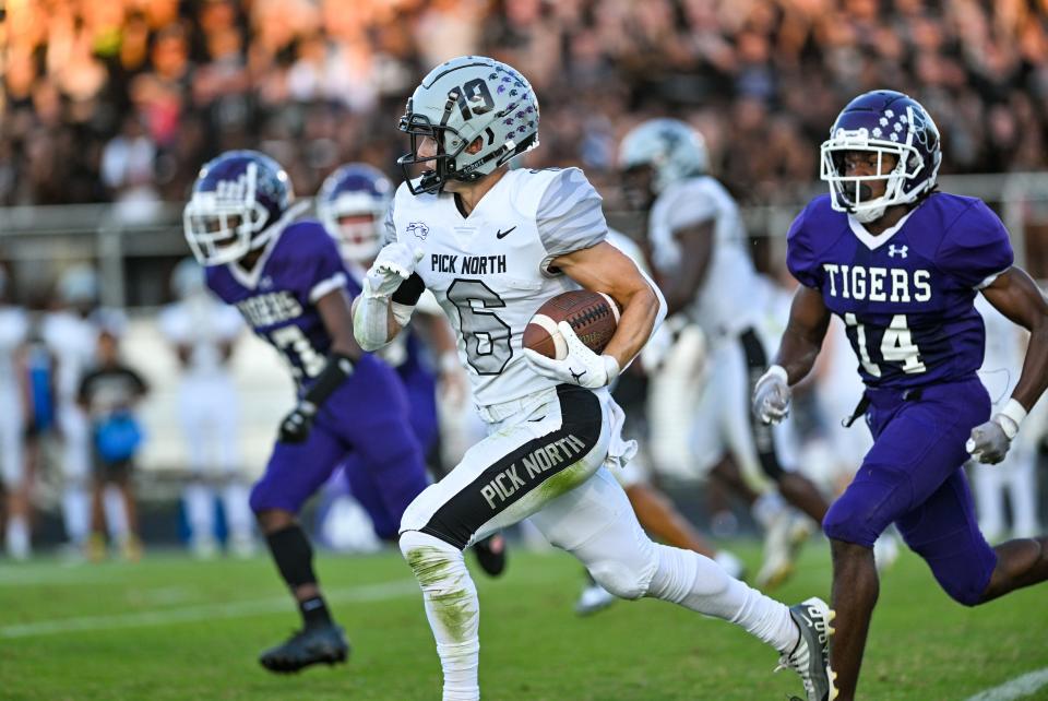 Pickerington North’s Cayden Christopher returns a punt against Pickerington Central on Sept. 9.